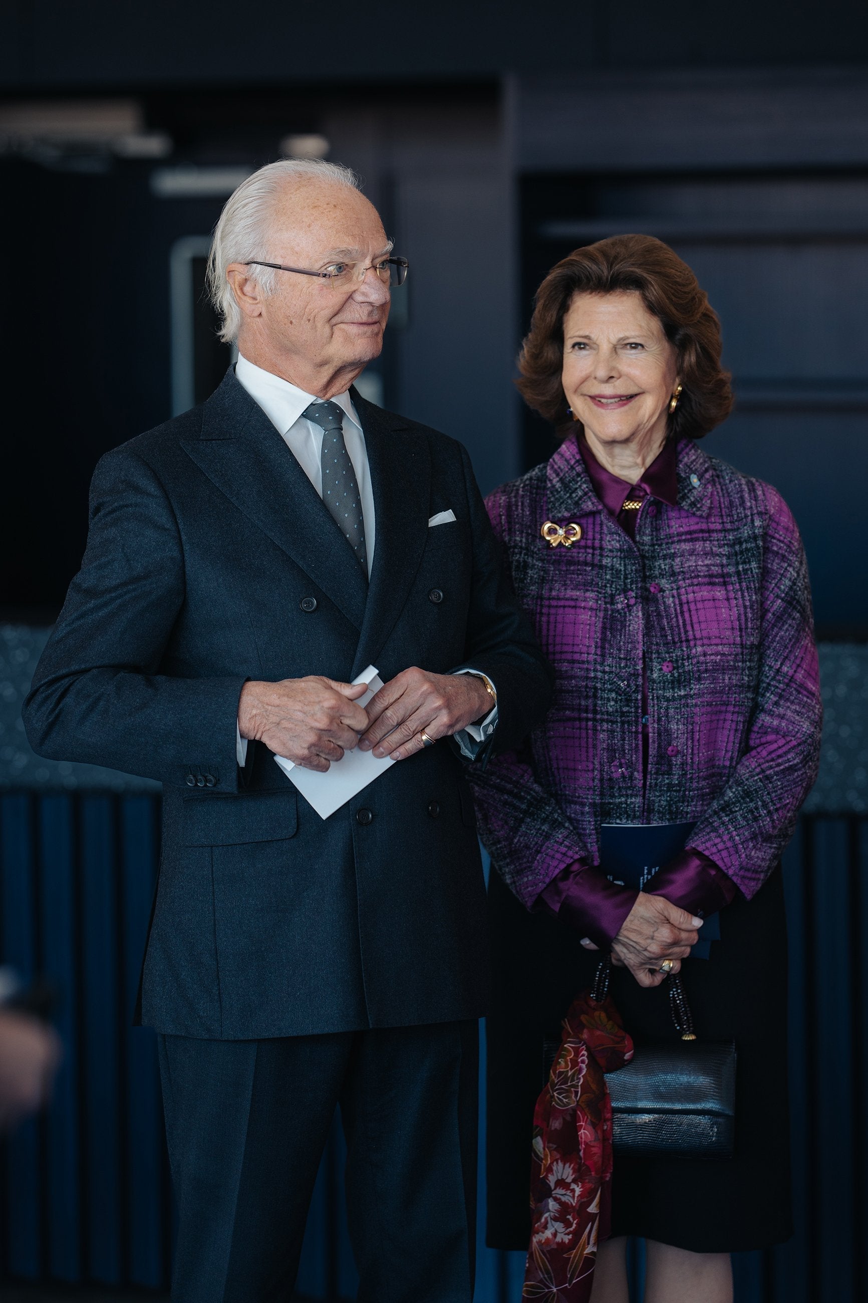 Queen Silvia of Sweden carrying a Darby Scott Iconic Handbag