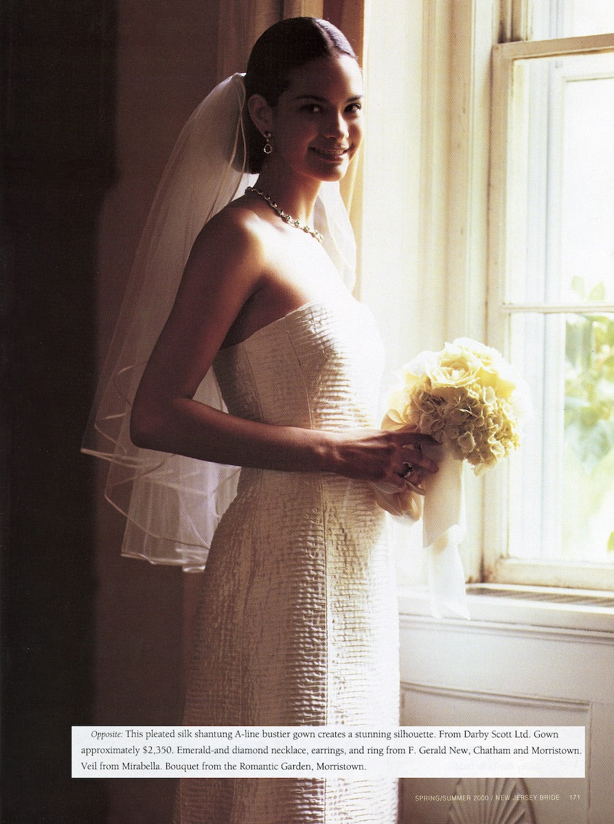 Model in a pleated silk shantung A-Line Gown by Darby Scott