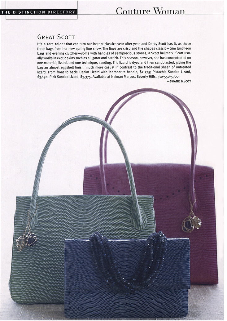 Article about Darby Scott featuring her designs in blue, green and pink lizard handbags as seen in Distinction Magazine Spring 2004