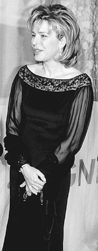 Queen Noor as seen in Women's Wear Daily Magazine January 2004 issue