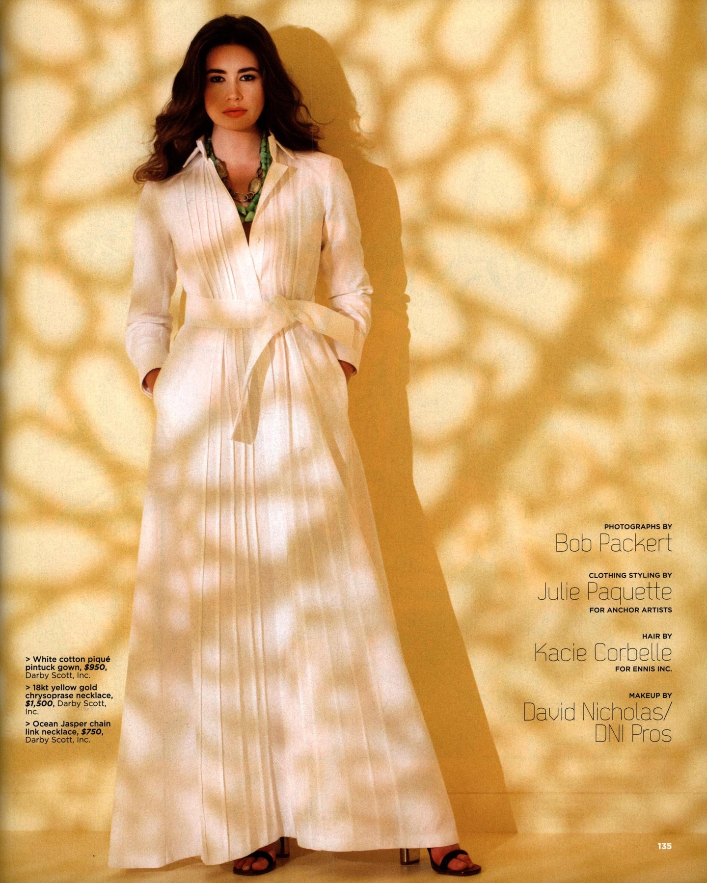 Model in white pintuck gown and wearing chrysoprase and ocean jasper necklaces by Darby Scott