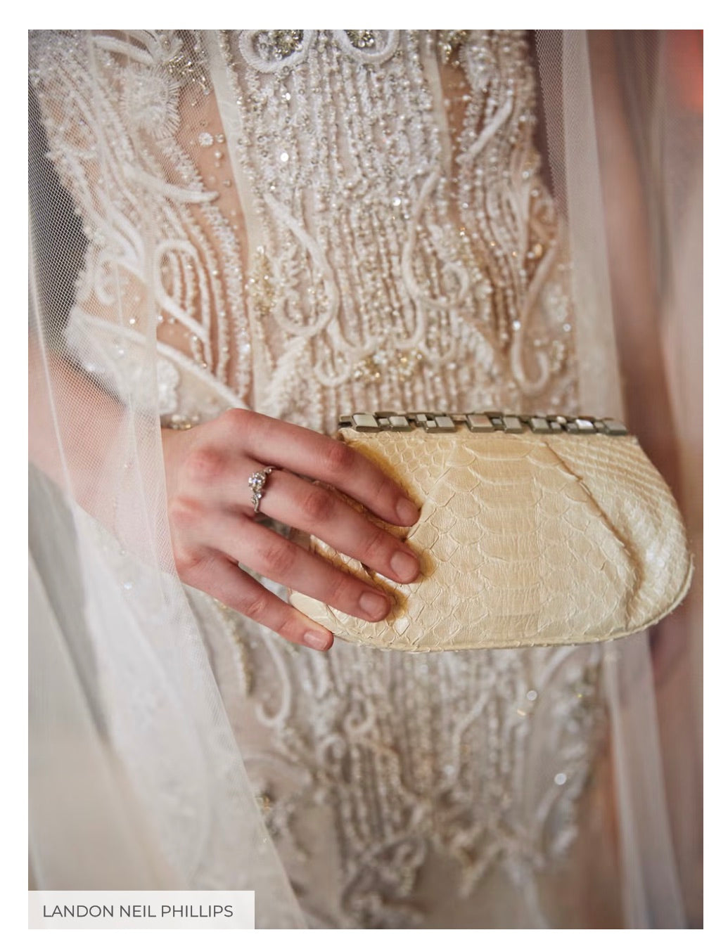 Close up of an ivory python clutch by Darby Scott and a diamond engagement ring by De Beers Jewelers - Photo Credit Landon Neil Phillips