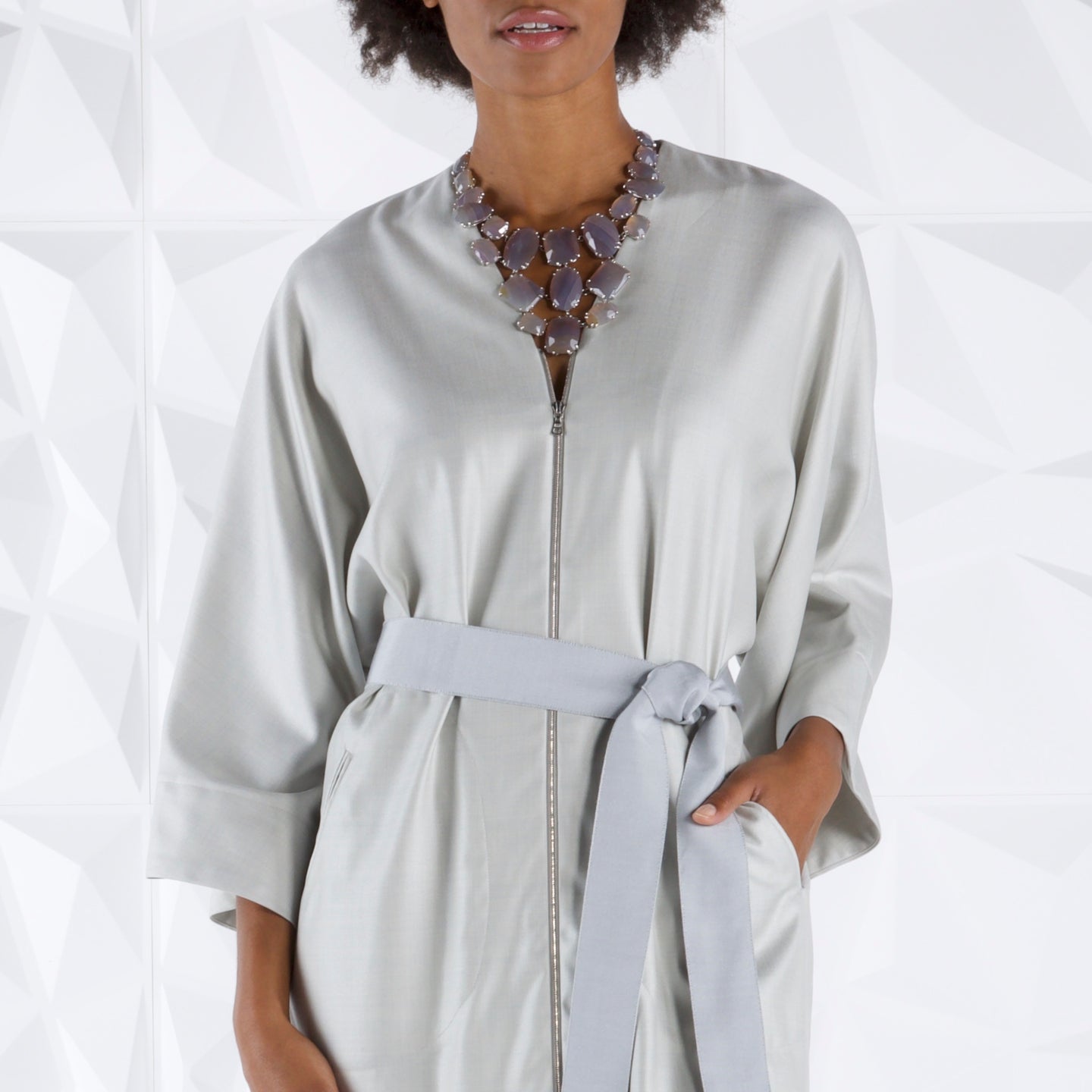 Grey Agate Necklace on a model wearing a silver kimono style dress - Darby Scott