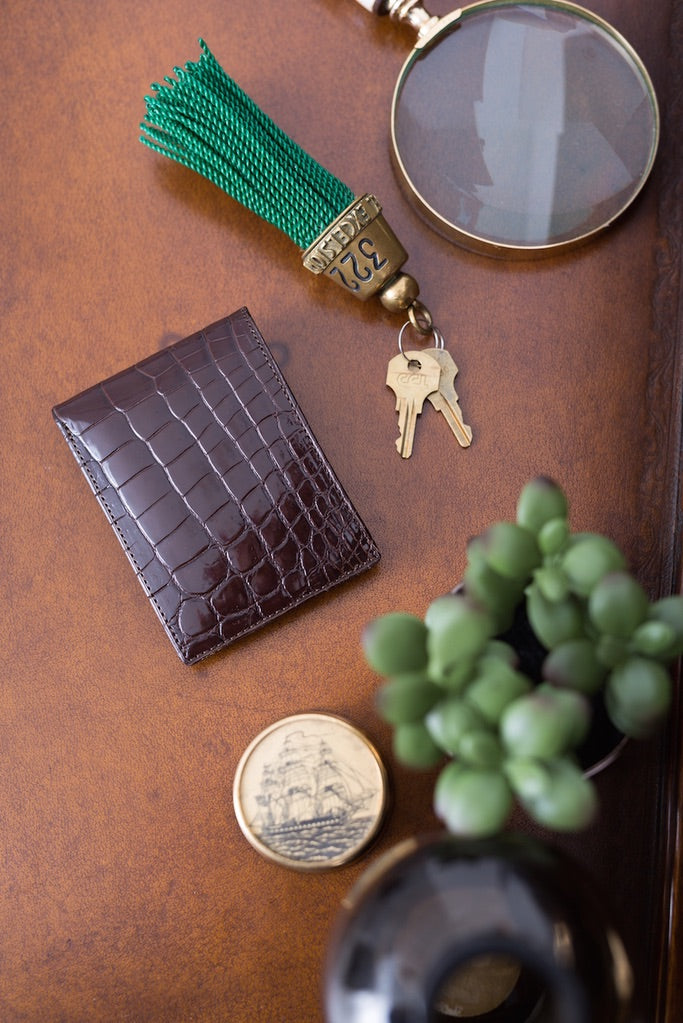 Brown Exotic Nile Crocodile Classic Slim Bi-Fold Wallet on Desk with keys - Darby Scott