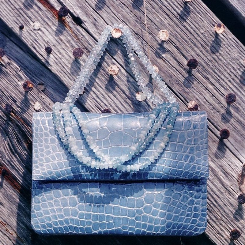 Blue iconic necklace handbag by Darby Scott