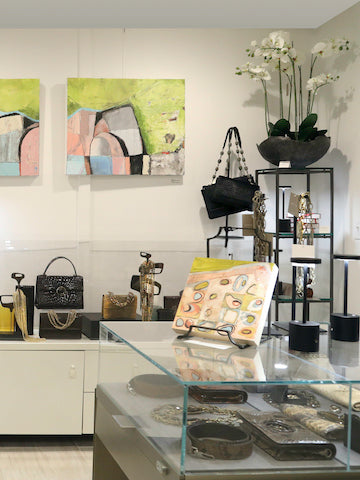 View of paintings and handbag displays in Darby Scott's Mill Shop