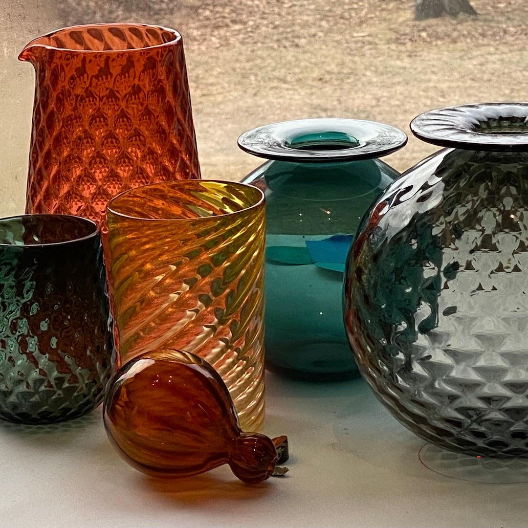 glasses and vases in a variety of fall colors