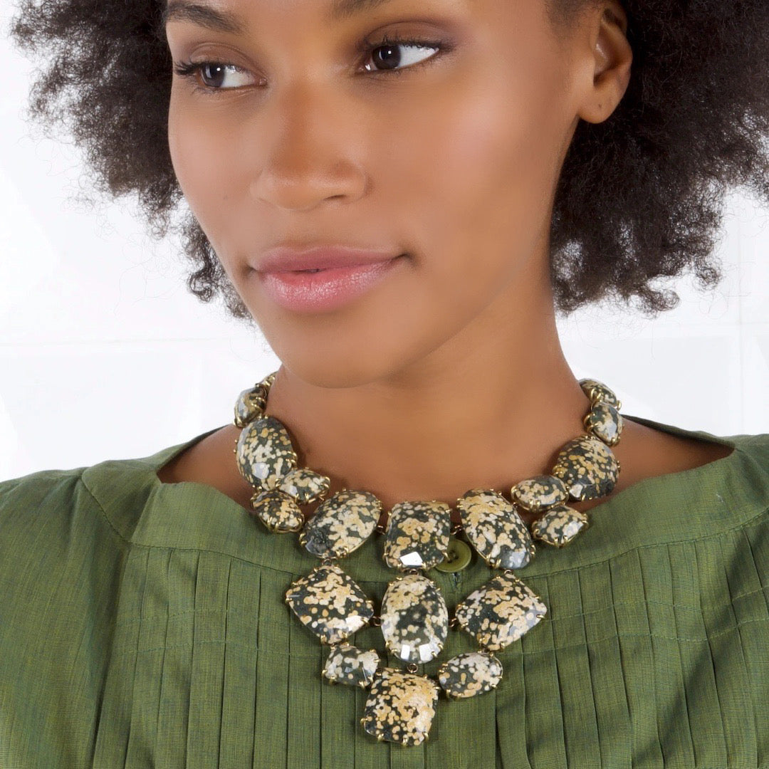 Bib style statement necklace in leopard jasper cabochons on model - Darby Scott