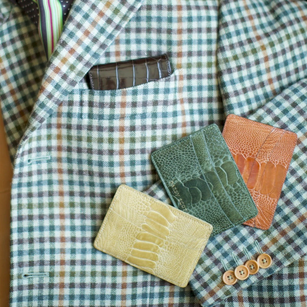 Plaid jacket with yellow, green and orange credit card holders on it.