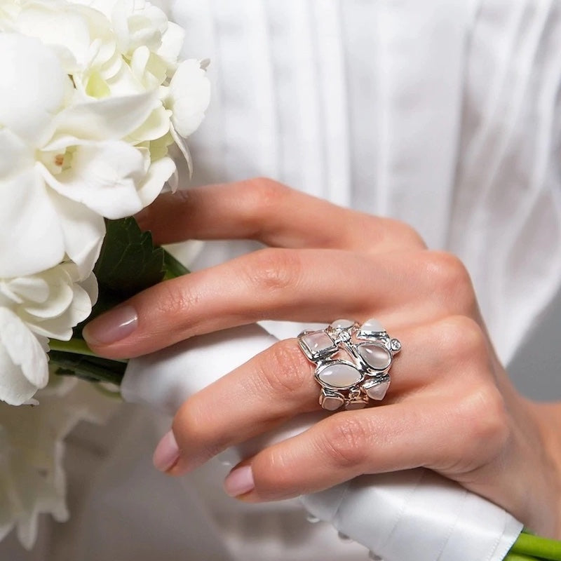 Moonstone & Diamond Mosaic Ring on woman holding bouquet of flowers - Darby Scott