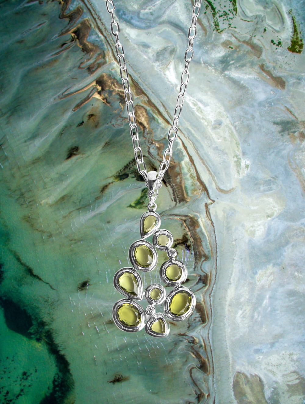 Sterling Silver Pendant in Mosaic style with nine peridot gemstones and diamond accents
