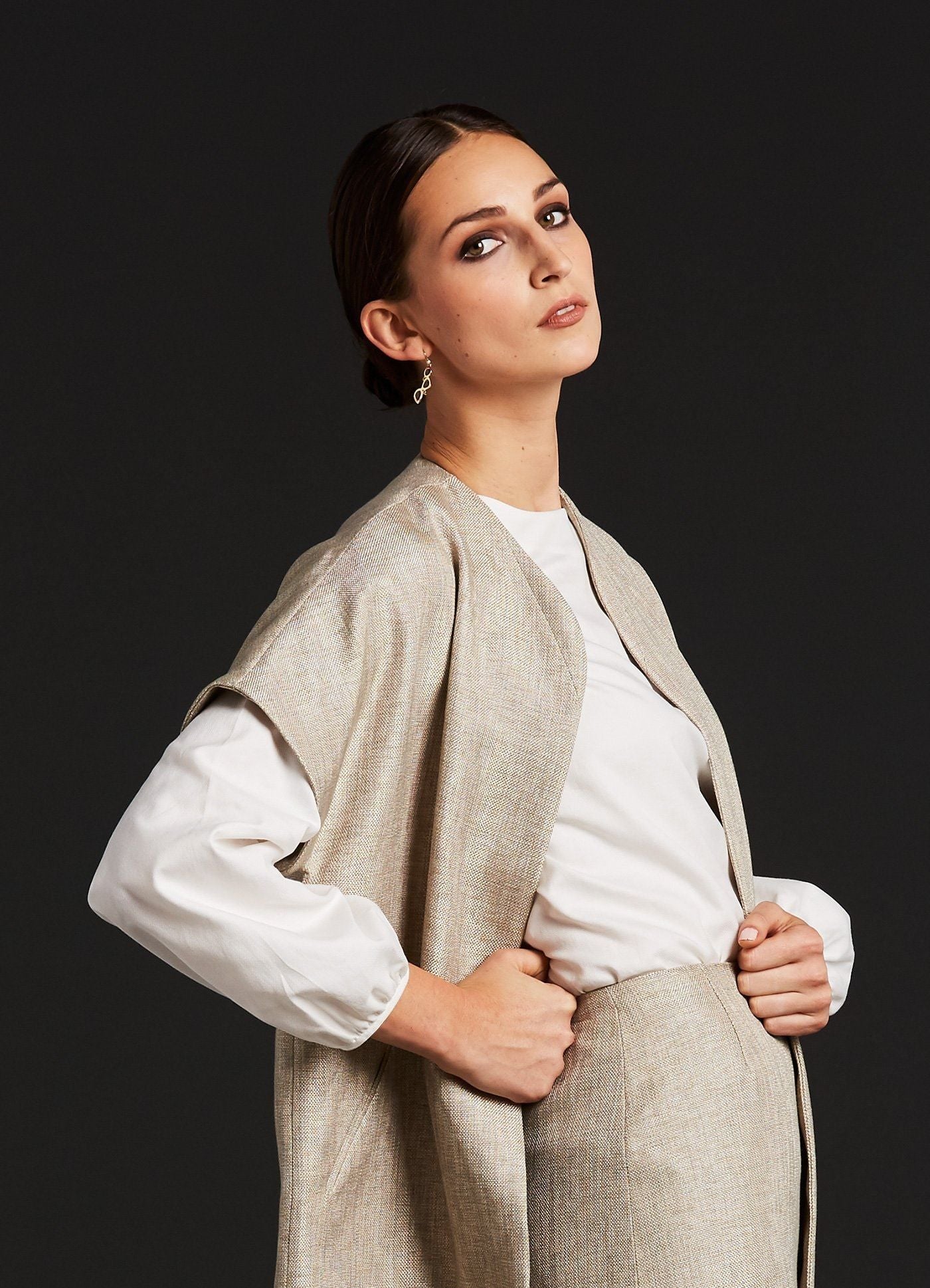 Close up of Topper Coat, Pencil Skirt & white blouse on model - Darby Scott