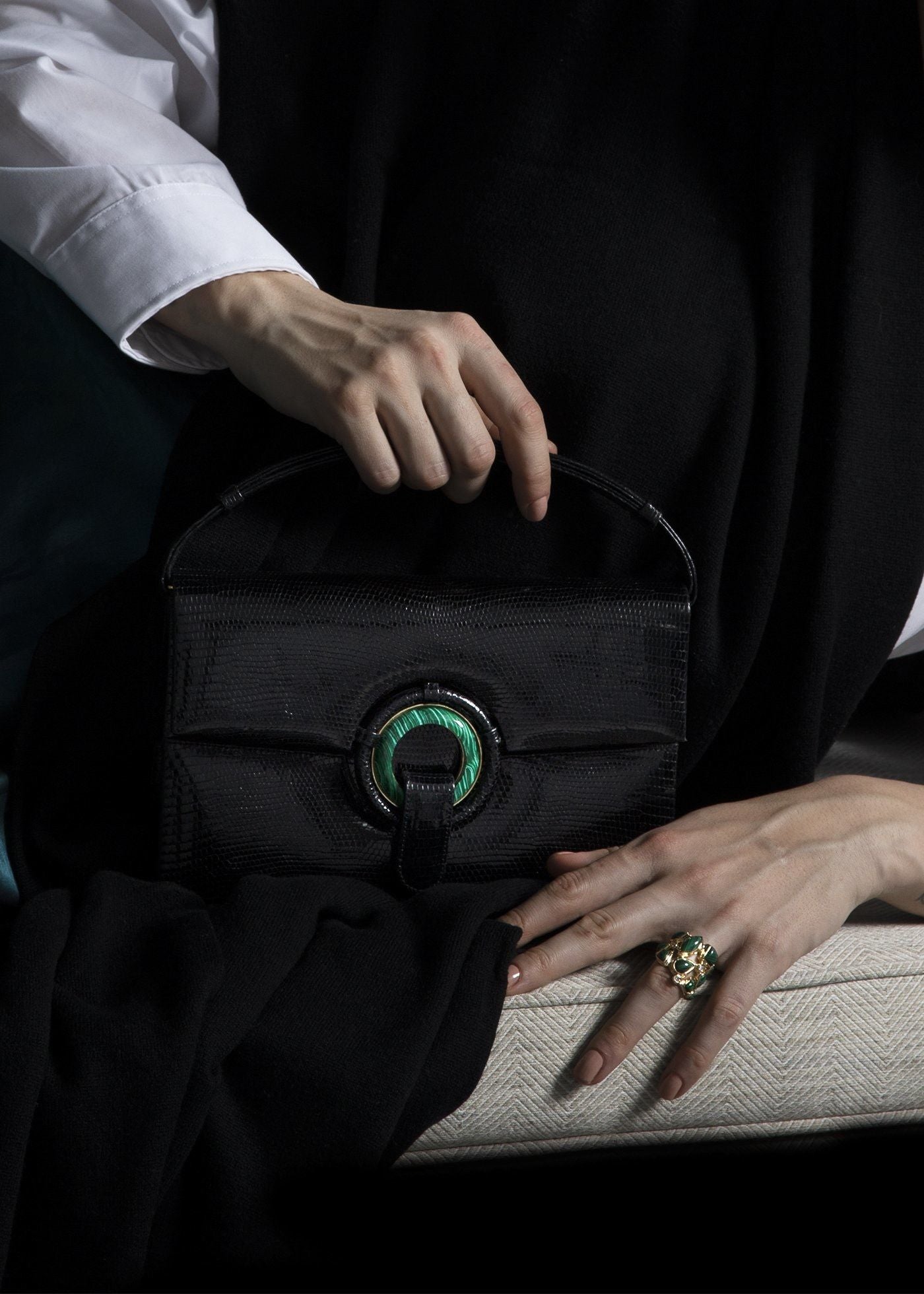 Model with Black Lizard Handbag with Malachite Grommet - Darby Scott