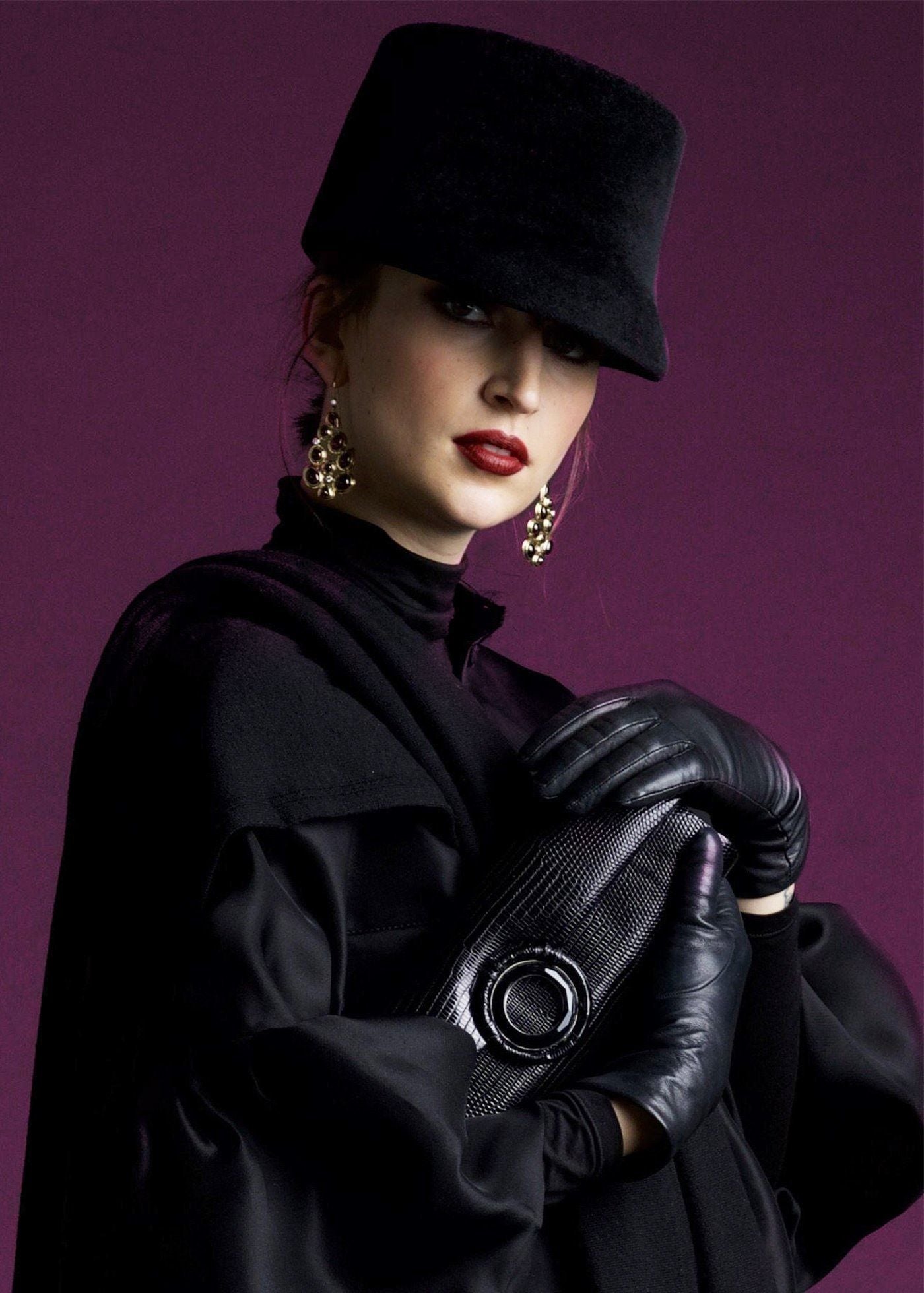 Model with Black Lizard Grommet Roll Clutch - Darby Scott