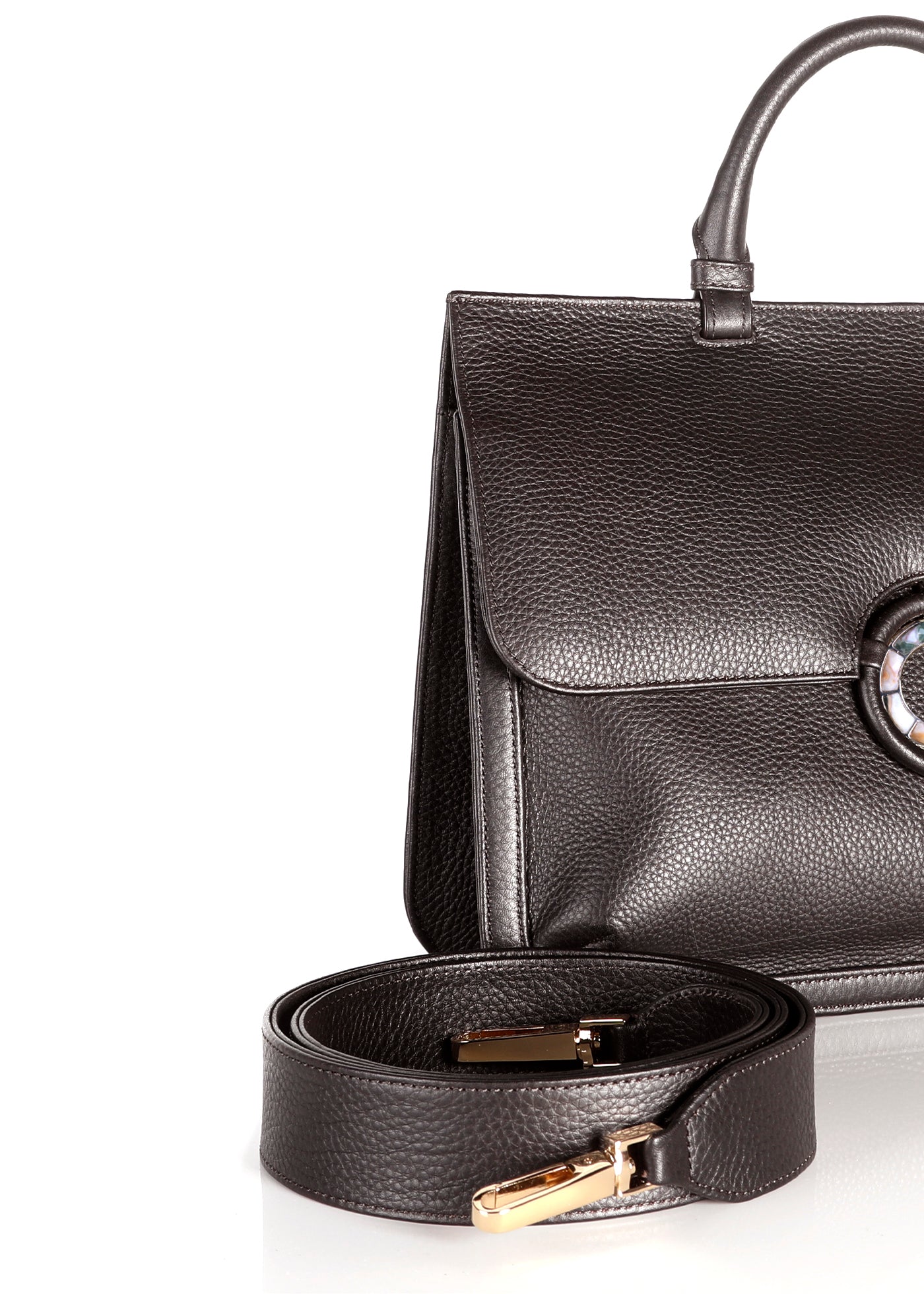 Detail View of detachable crossbody strap and side of brown leather saddle bag - Darby Scott