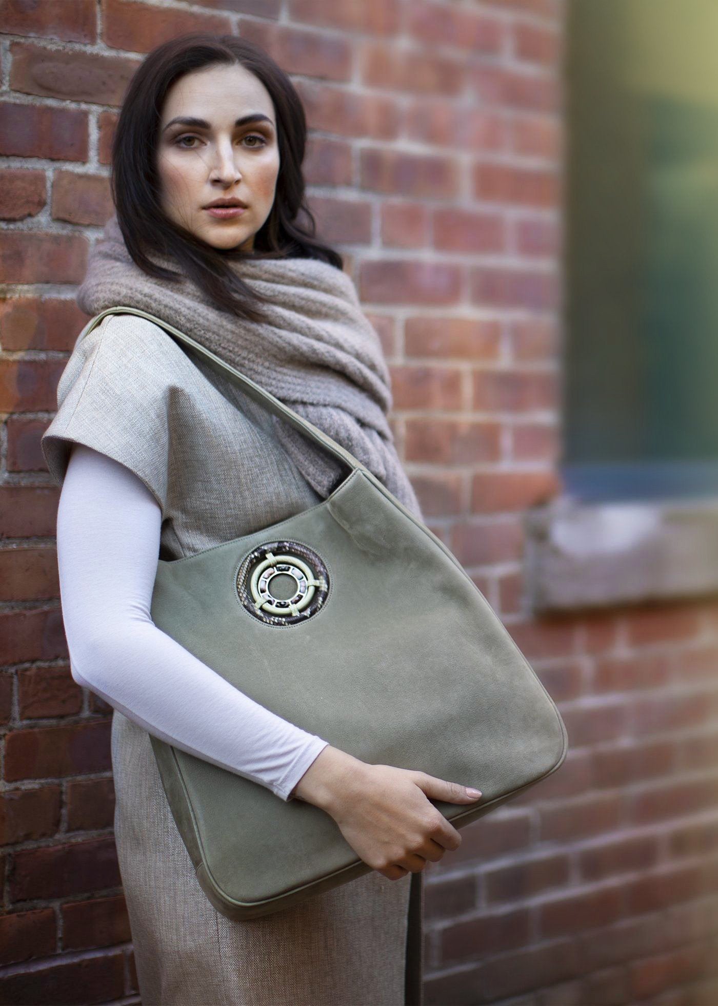 Paige Hobo in Celedon Sueded Leather held by model - Darby Scott