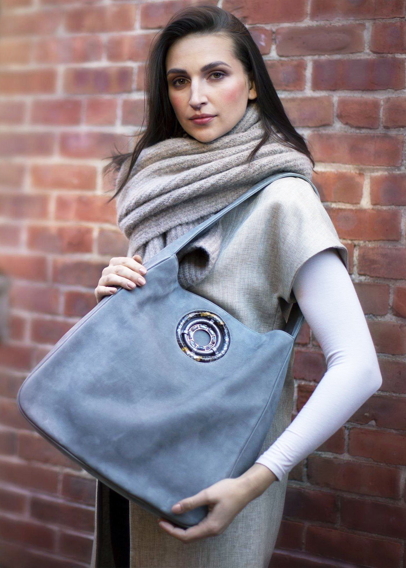 Paige Hobo in Denim Suede held by model - Darby Scott