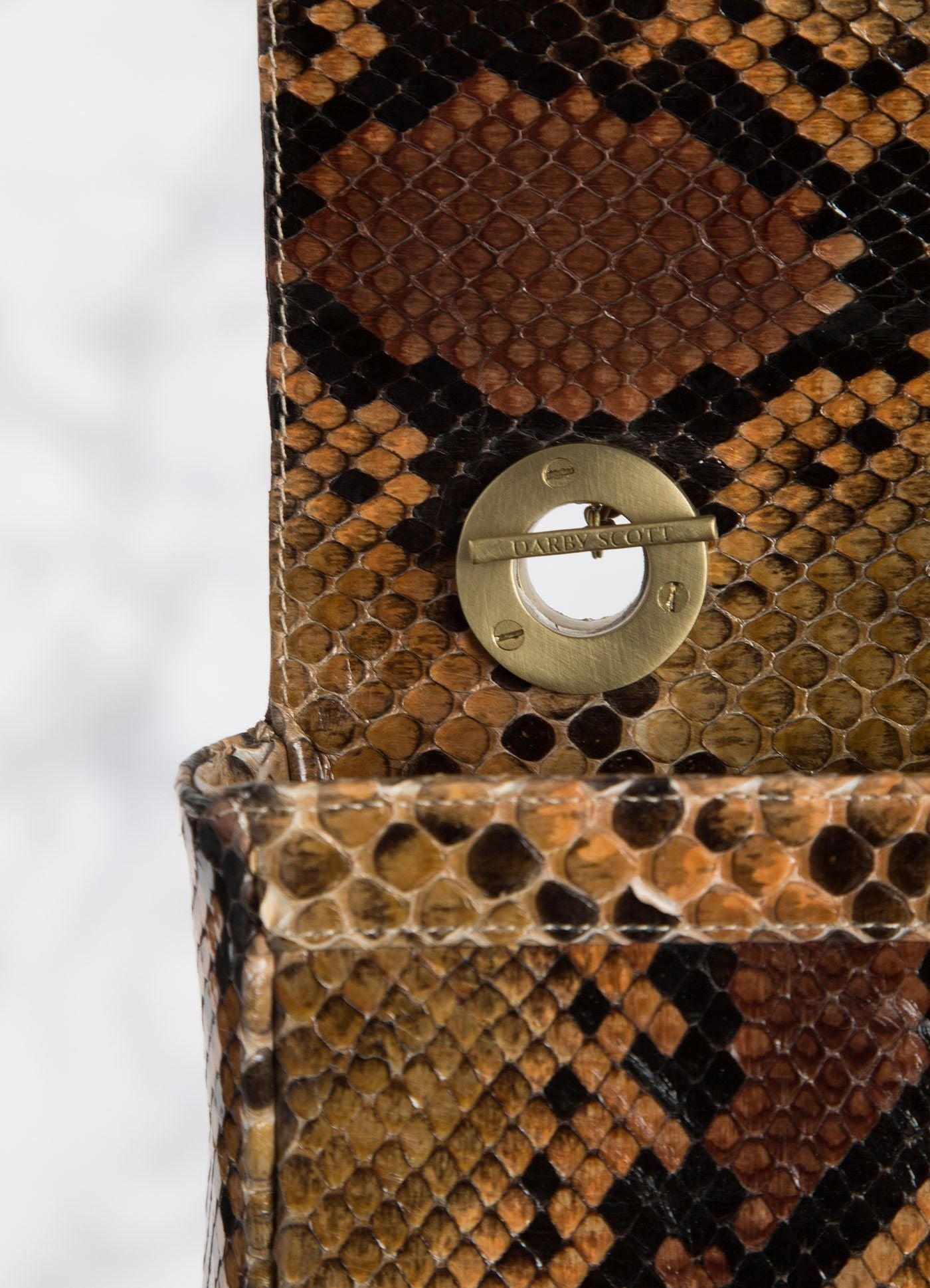 Interior view of handle toggle on Brown and black Shoulder Bag - Darby Scott