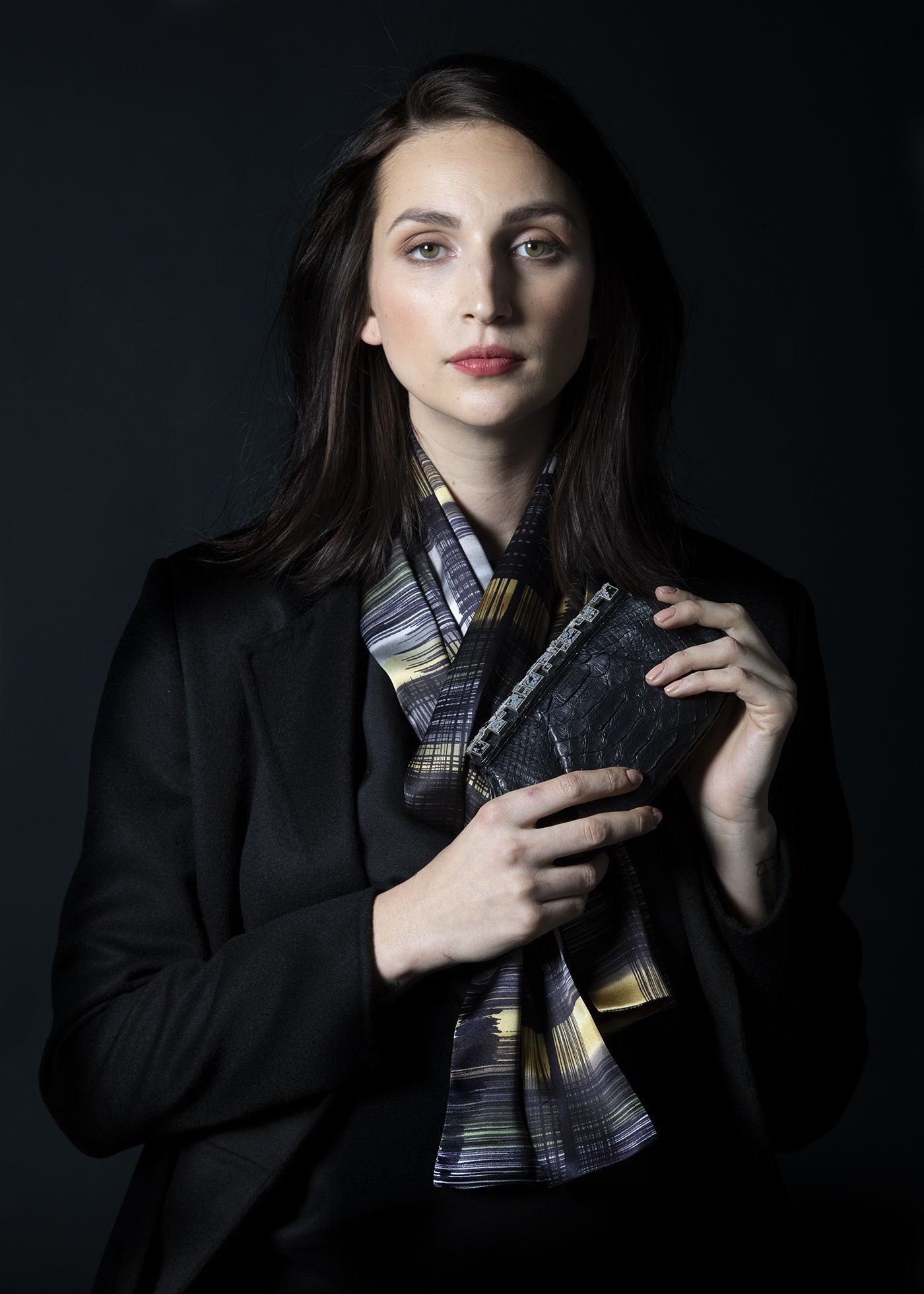 Model in Abstract Plaid Silk Scarf with a black python art deco clutch - Darby Scott