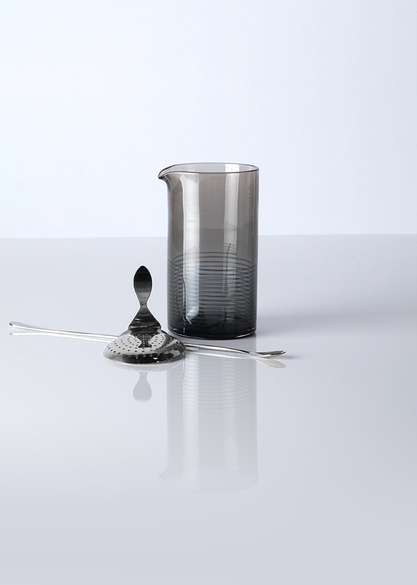Hand blown smoke grey mixing glass with long spoon and strainer