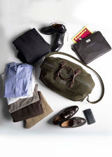 An array of items ready to pack in Aspen Duffel Bag - Darby Scott