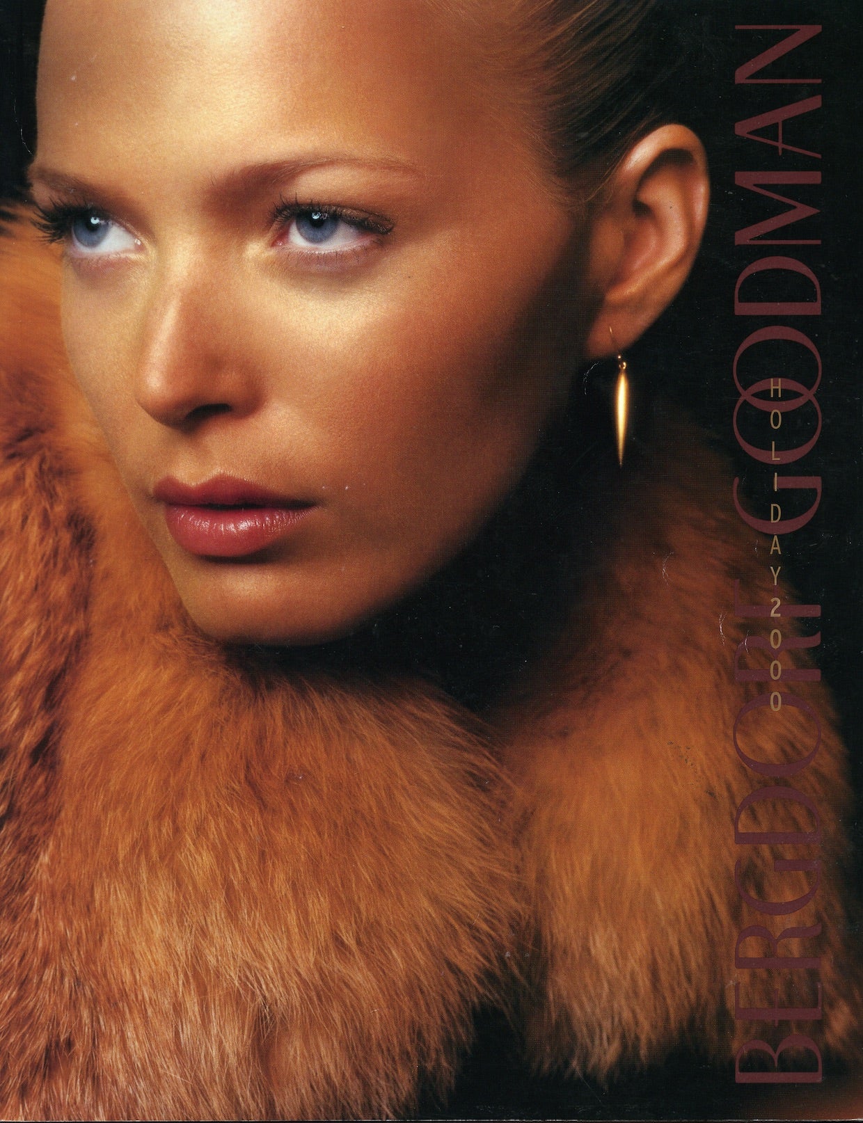 Model in fur collar cover of Bergdorf Goodman Holiday 2000