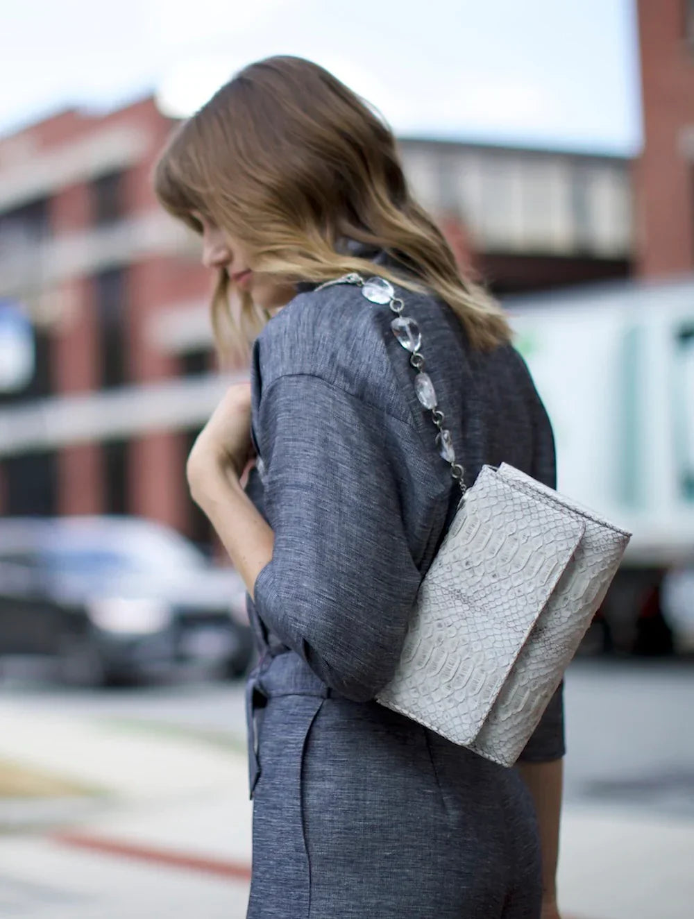 Model with Darby Scott chain and jewel shoulder bag