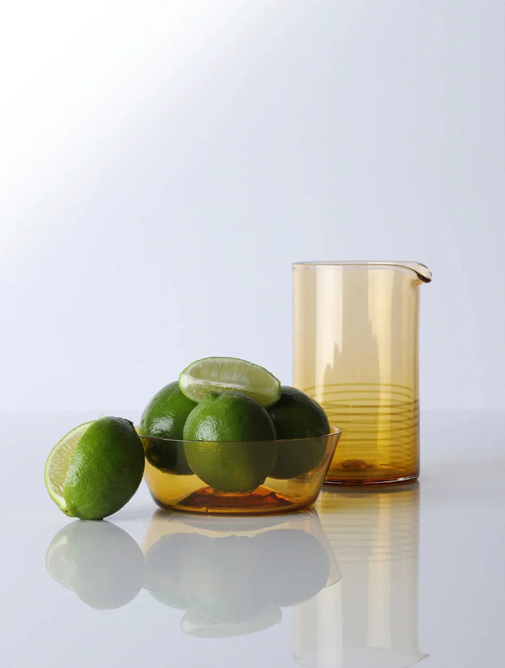 Citrine Colored Mixing Glass and bowl with limes - Darby Scott