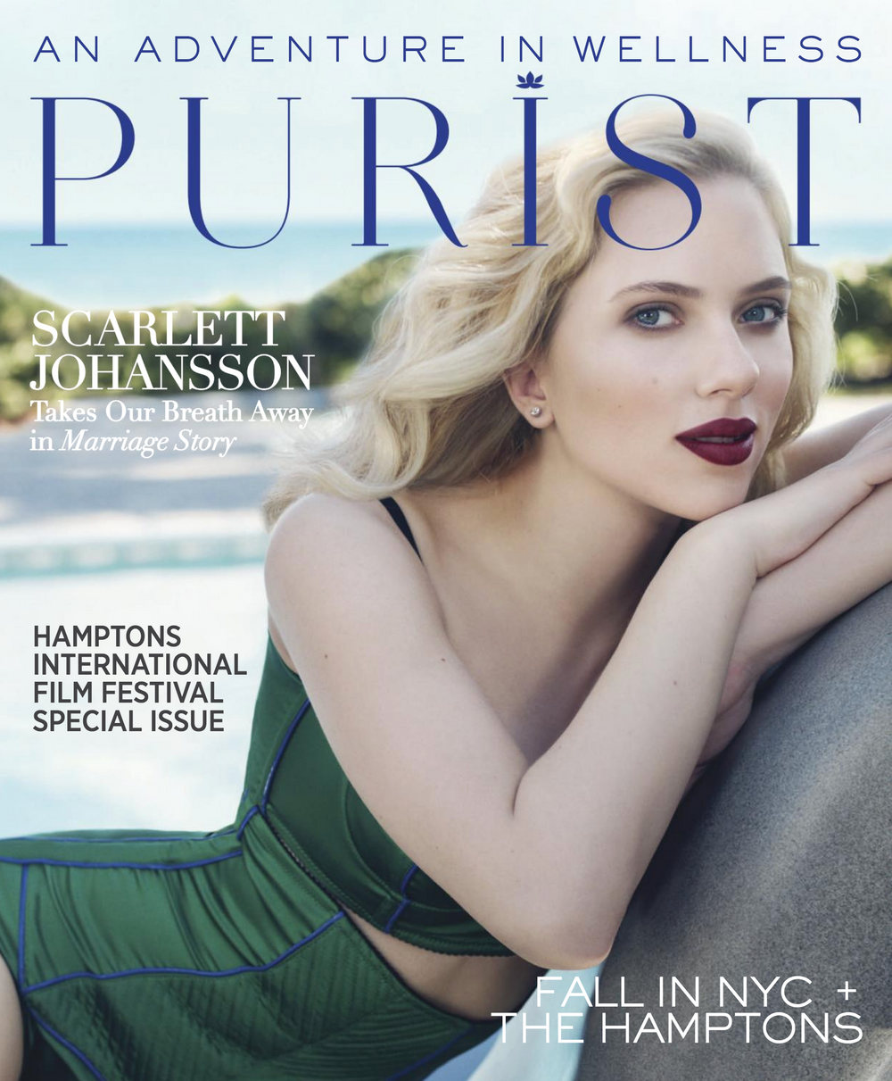 Scarlett Johansson leaning on rock on cover of Purist Magazine