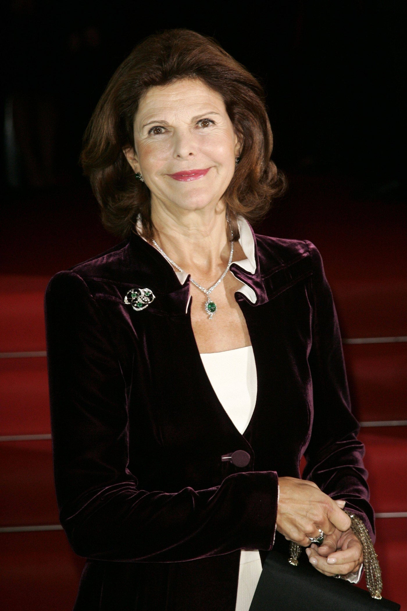 Queen Silvia of Sweden carrying one of her Darby Scott Handbags