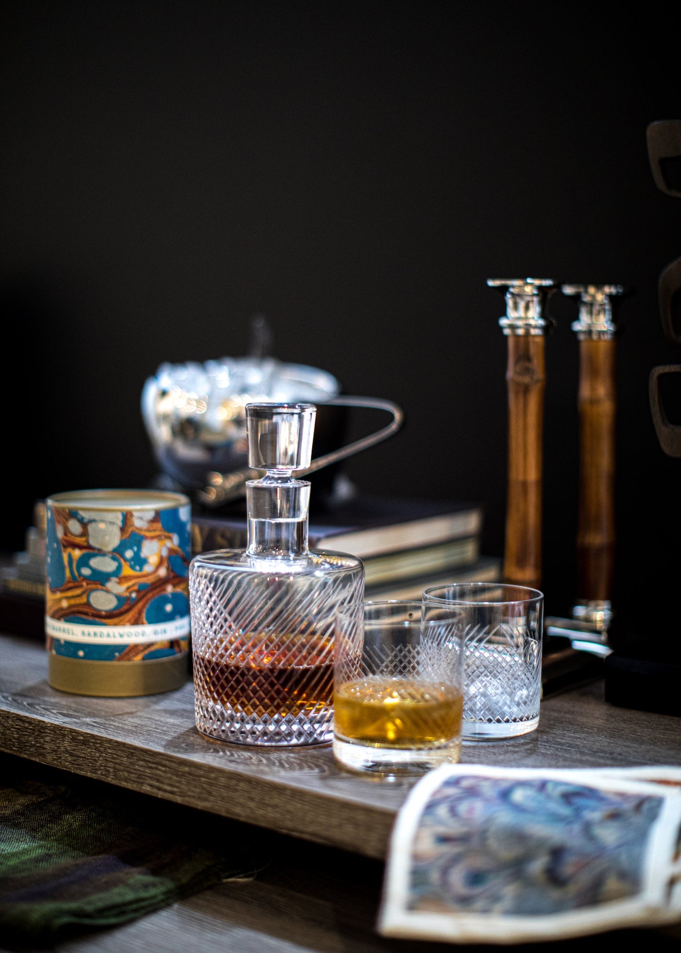 Cut Glass Decanter and glasses, candle holders on table - Darby Scott