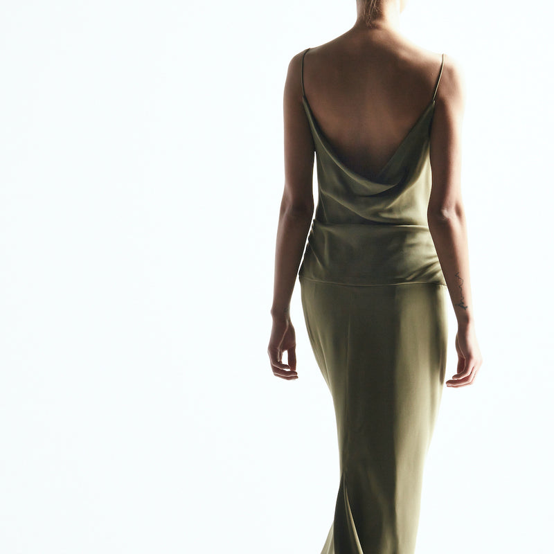 Model wearing a drape back gown by Darby Scott 