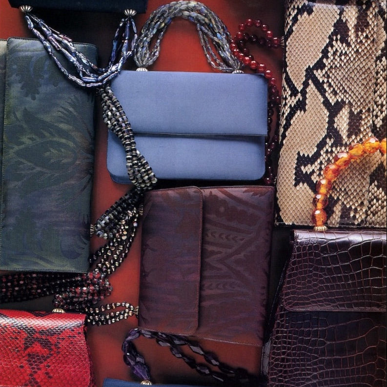 Collection of necklace handled handbags designed by Darby Scott 