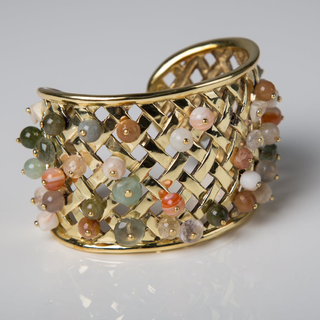 Cuff Bracelet in gold lattice net with a variety of beads caught in the net - Darby Scott