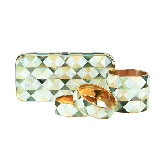 Jewelers Showcase including Darby Scott's Harlequin minaudiere and cuff bracelets.