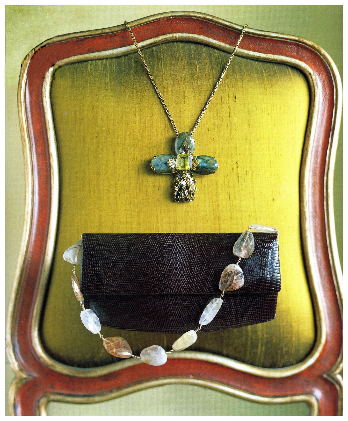 A Darby Scott Lizard Handbag with a Quartz Handle in front of a mirror
