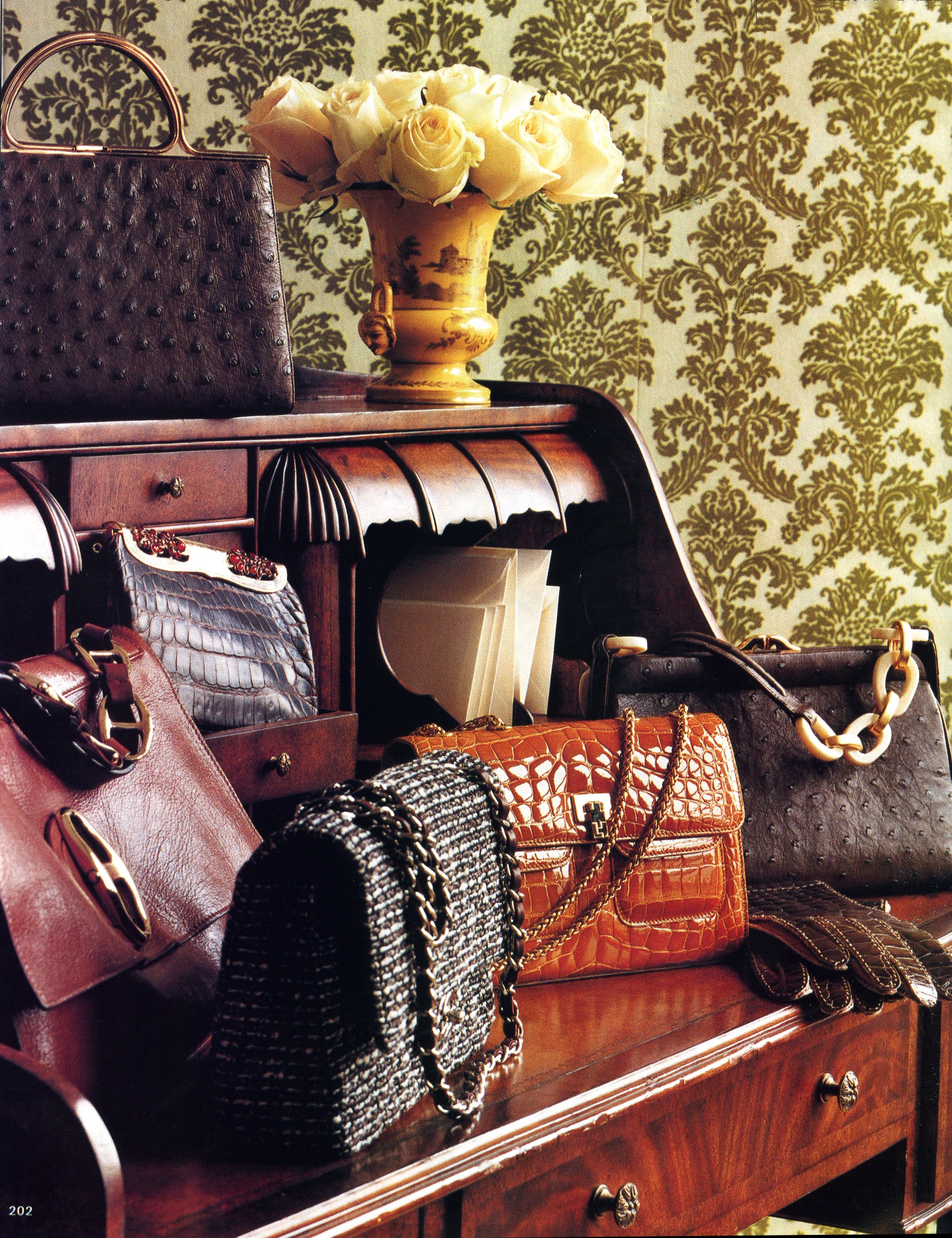 Town & Country Fall Handbag Picks displayed on a desk. Darby Scott brown ostrich bag with bone link handle is included