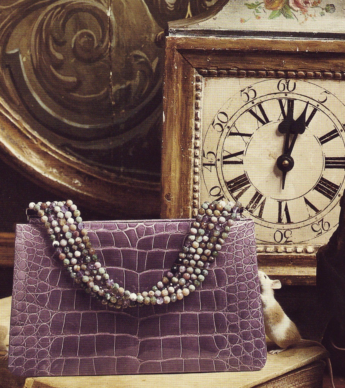 Mauve Alligator Handbag in FairyTale Setting with clock, candlestick, books and mice