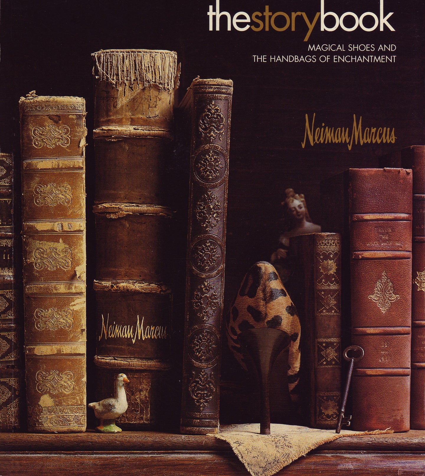 Cover of Neiman Marcus 'The Story Book' with books and a shoe on a shelf