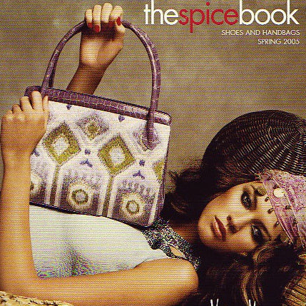 Model holding embroidered brocade tote with alligator trim and handles - Darby Scott