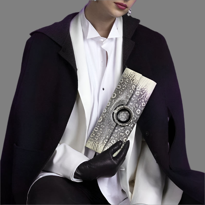 Model Holding a Grommet Roll Clutch in Ring Lizard by Darby Scott