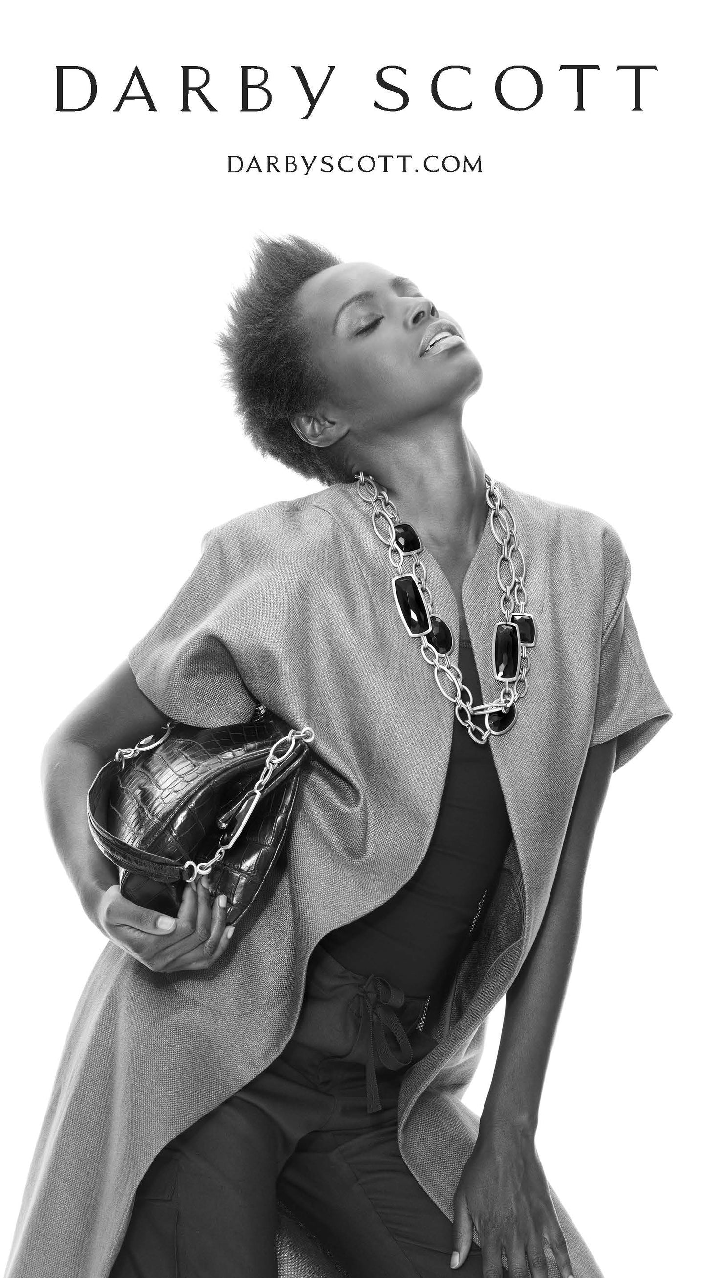 Chain & Jewel Necklaces on model carrying Chain & Jewel Handled Shoulder Bag - Darby Scott 