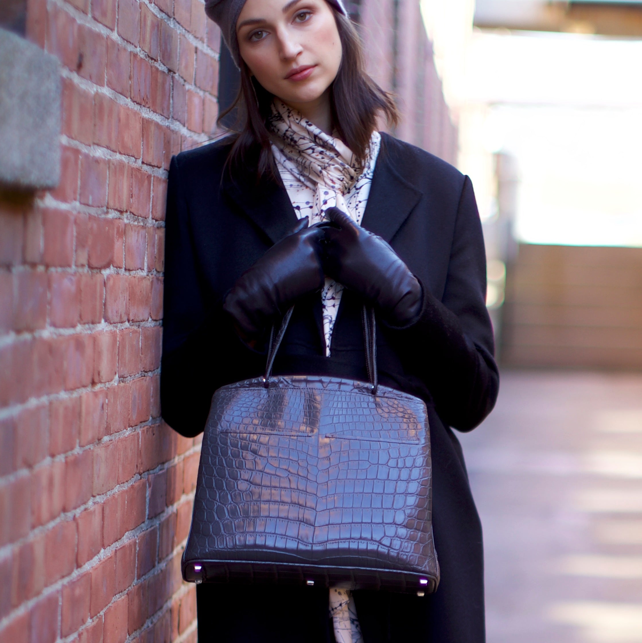 Model holding a Crawford Handbag by Darby Scott 