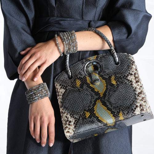 Annette Handbag in Blue Python and Labradorite Bracelets on a model - Darby Scott 