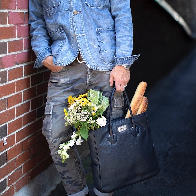 Man holding a Navy Essex Tote filled with flowers and baguettes - Darby Scott