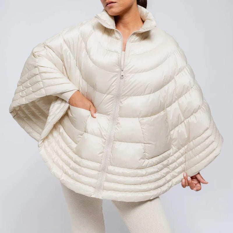 Ivory puffer cape-poncho on model