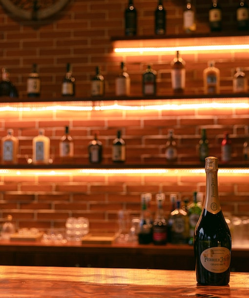 Bar set up in moody amber hue - Photo Credit Hanxiao 