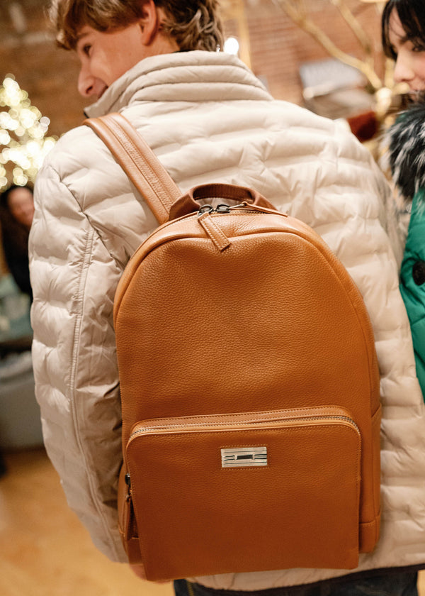 Cognac leather backpack on man