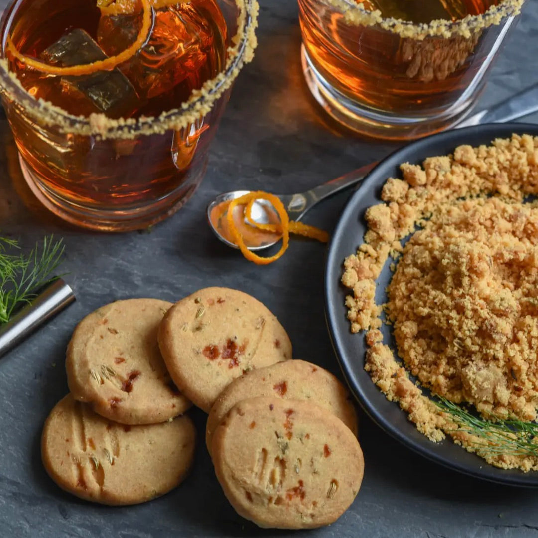 Burnt sugar & fennel shortbread on table with drinks