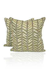 Pair of throw pillows in olive and white chevron pattern 
